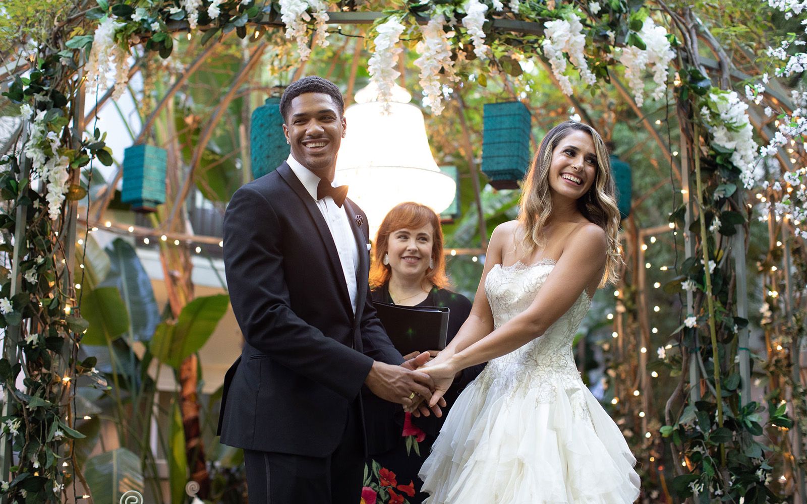 Couple getting married under gazebo